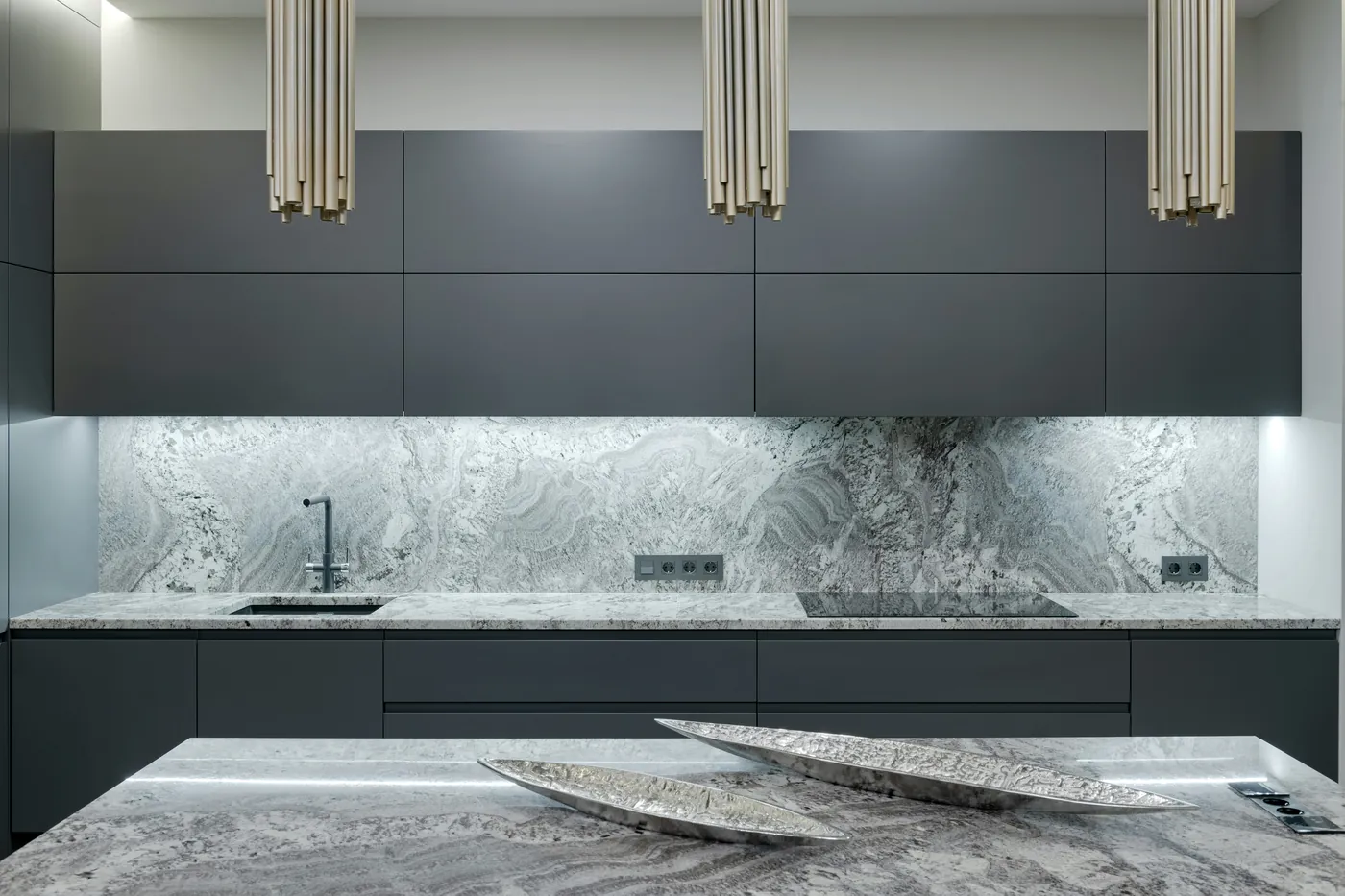 After: the kitchen with matte graphite slab doors and drawer fronts.