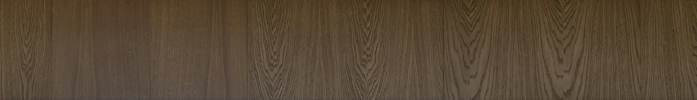 Book-matched oak veneer panels in a dark walnut stain, showing the cathedral grain.